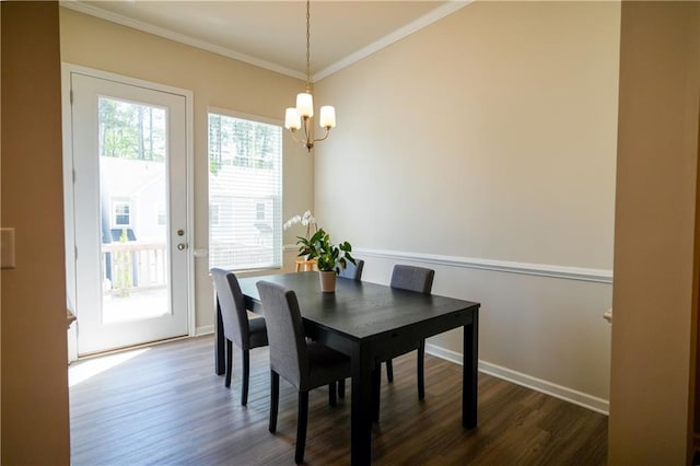 458 Bishop Ln, Woodstock, GA 30188 - dining area with a chandelier, ornamental molding, dark wood-style flooring, and baseboards