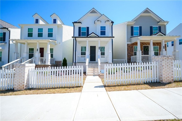 458 Bishop Ln, Woodstock, GA 30188 - view of front facade with covered porch and a fenced front yard