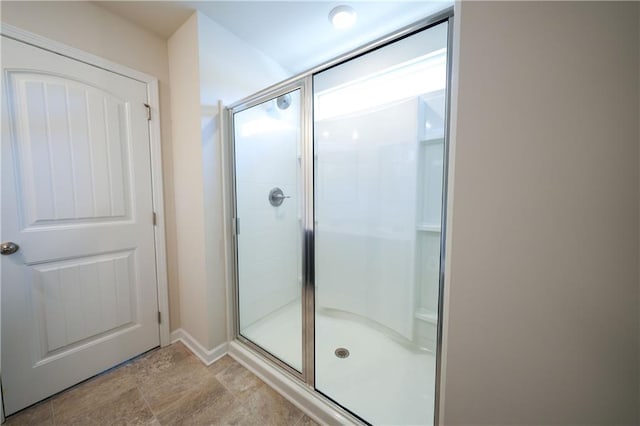 458 Bishop Ln, Woodstock, GA 30188 - bathroom featuring a stall shower and baseboards