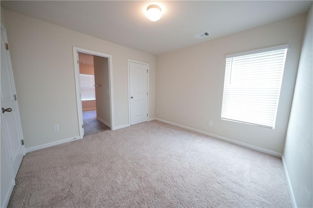 458 Bishop Ln, Woodstock, GA 30188 - unfurnished bedroom featuring carpet, baseboards, and ensuite bath