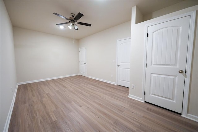 458 Bishop Ln, Woodstock, GA 30188 - unfurnished bedroom with wood finished floors, baseboards, and ceiling fan