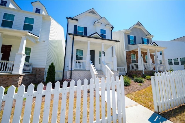 458 Bishop Ln, Woodstock, GA 30188 - view of front of home with covered porch and a fenced front yard