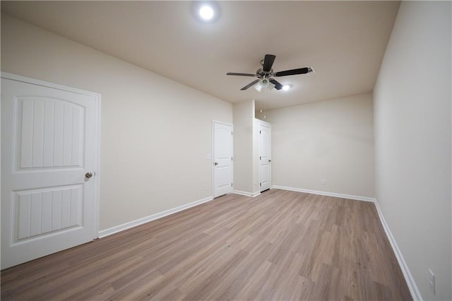 458 Bishop Ln, Woodstock, GA 30188 - unfurnished bedroom featuring light wood finished floors, baseboards, and ceiling fan