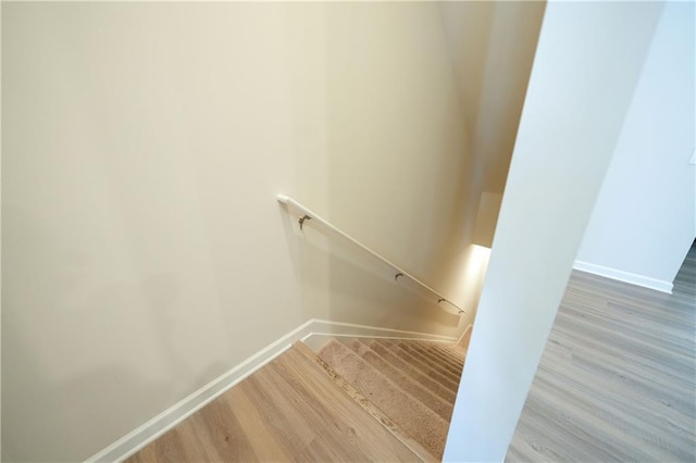 458 Bishop Ln, Woodstock, GA 30188 - stairway with baseboards and wood finished floors