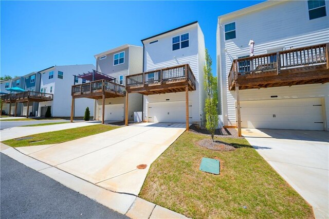 458 Bishop Ln, Woodstock, GA 30188 - view of front of property with a garage, driveway, a wooden deck, and a residential view