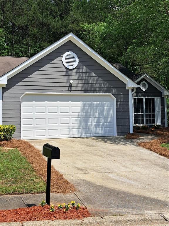 garage featuring driveway