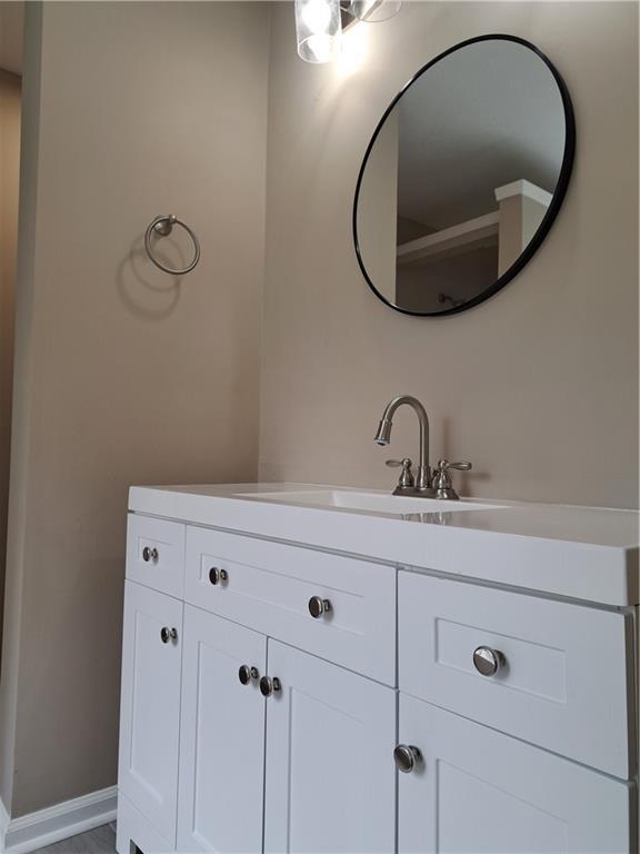 bathroom featuring vanity and baseboards