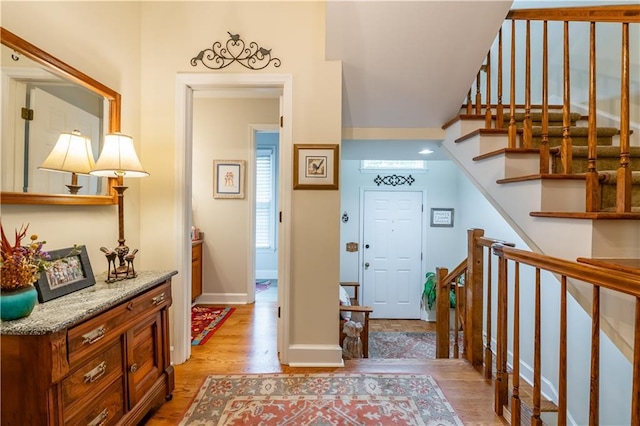 3833 Savannah Sq E, Atlanta, GA 30340 - entrance foyer with light wood-type flooring, stairway, and baseboards