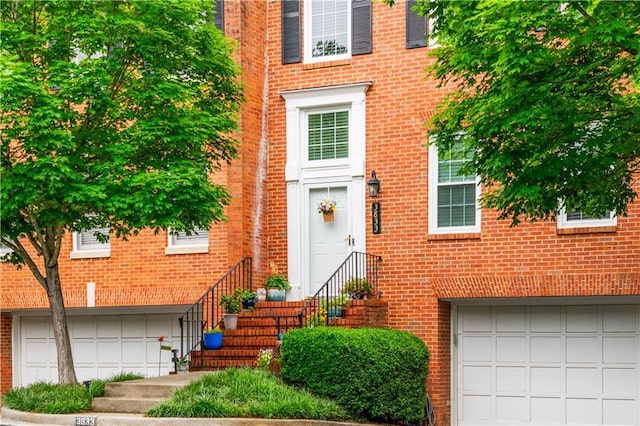 3833 Savannah Sq E, Atlanta, GA 30340 - view of exterior entry featuring an attached garage and brick siding