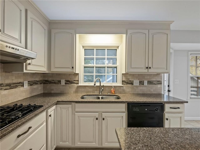 kitchen with backsplash, sink, white cabinets, and black appliances