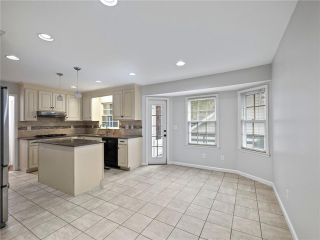 kitchen featuring sink, decorative backsplash, decorative light fixtures, light tile patterned flooring, and stainless steel appliances