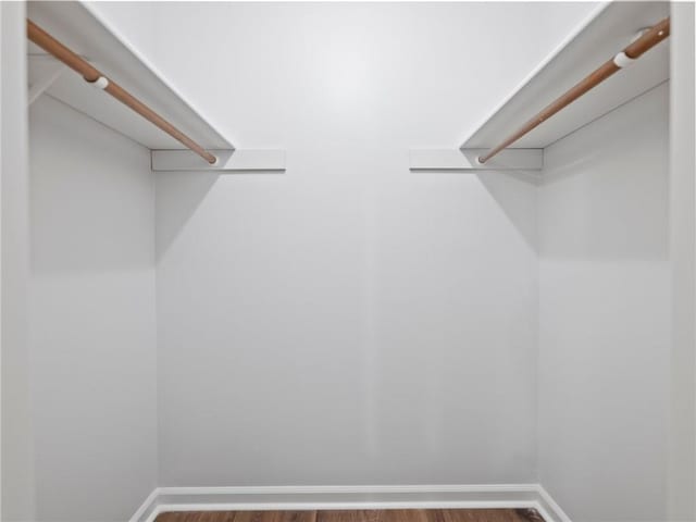 walk in closet featuring hardwood / wood-style floors