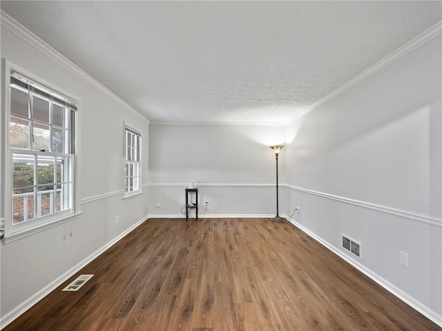 unfurnished room featuring crown molding and dark hardwood / wood-style floors