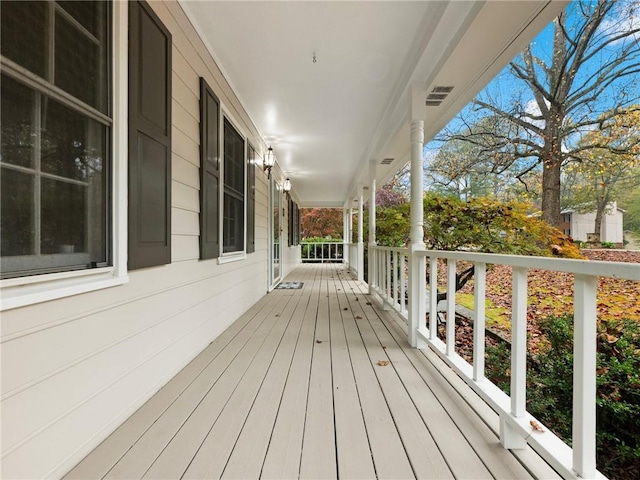 wooden deck featuring covered porch