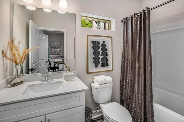 full bathroom with vanity, toilet, and shower / tub combo with curtain