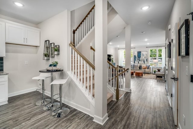 staircase featuring hardwood / wood-style flooring