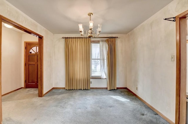 unfurnished room with baseboards, carpet floors, and an inviting chandelier