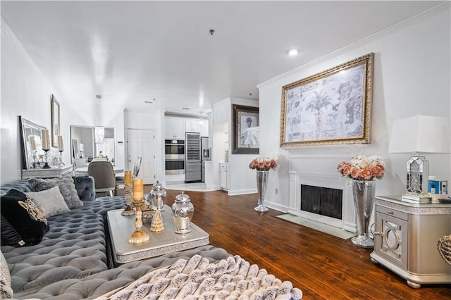 living room with dark hardwood / wood-style flooring and ornamental molding