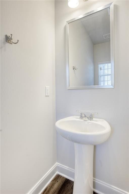 bathroom featuring wood-type flooring