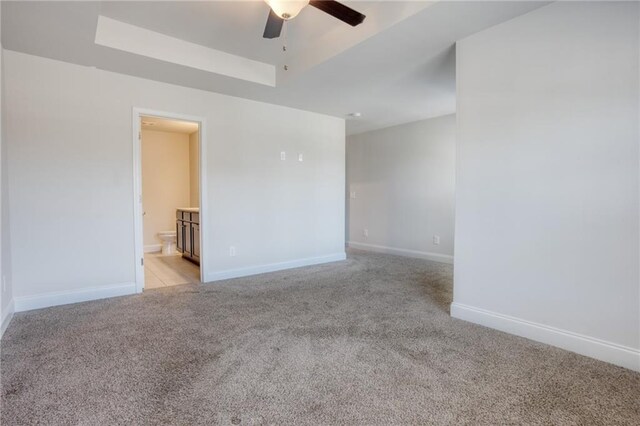 unfurnished room with ceiling fan and light colored carpet