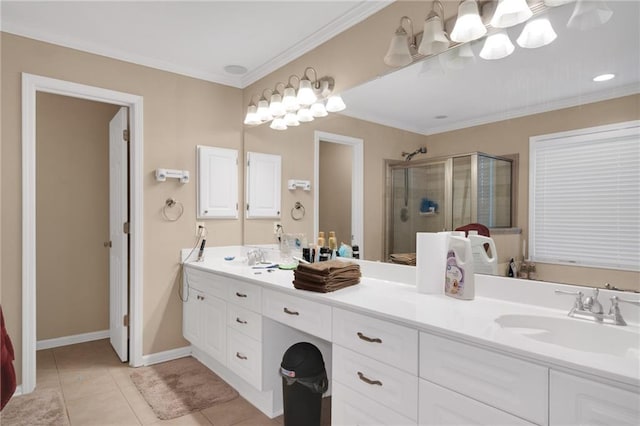 bathroom with vanity, tile patterned floors, crown molding, and a shower with shower door