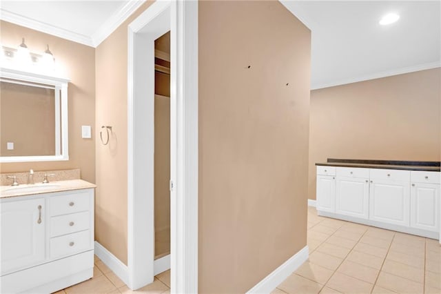 bathroom with ornamental molding, tile patterned flooring, and vanity