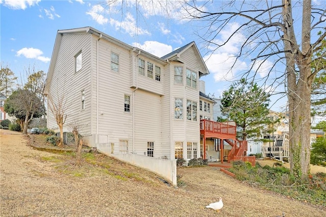 view of side of home with a deck