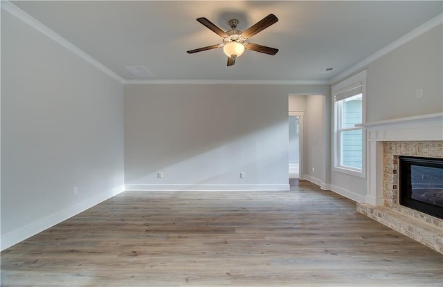 unfurnished living room featuring ceiling fan, ornamental molding, and light hardwood / wood-style flooring