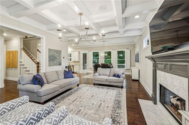 2585 Drew Valley Rd NE, Brookhaven, GA 30319 - living area with wood finished floors, stairs, baseboards, a chandelier, and beam ceiling