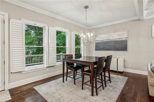 2585 Drew Valley Rd NE, Brookhaven, GA 30319 - dining space featuring baseboards, crown molding, a chandelier, and wood finished floors