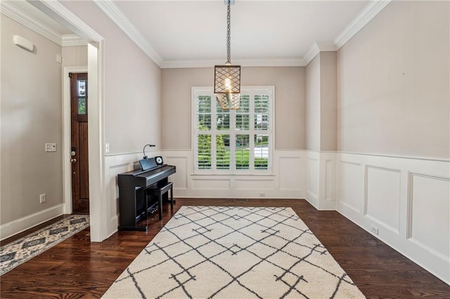2585 Drew Valley Rd NE, Brookhaven, GA 30319 - dining area with dark wood-style floors, crown molding, wainscoting, and a decorative wall