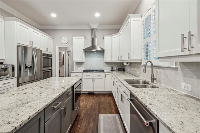 2585 Drew Valley Rd NE, Brookhaven, GA 30319 - kitchen featuring appliances with stainless steel finishes, a sink, wall chimney range hood, white cabinets, and crown molding