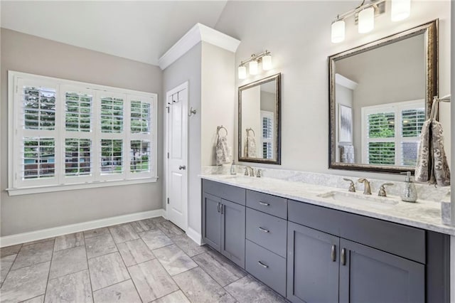 2585 Drew Valley Rd NE, Brookhaven, GA 30319 - bathroom with double vanity, baseboards, and lofted ceiling