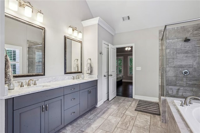 2585 Drew Valley Rd NE, Brookhaven, GA 30319 - bathroom with a bath, double vanity, a shower stall, baseboards, and ensuite bathroom