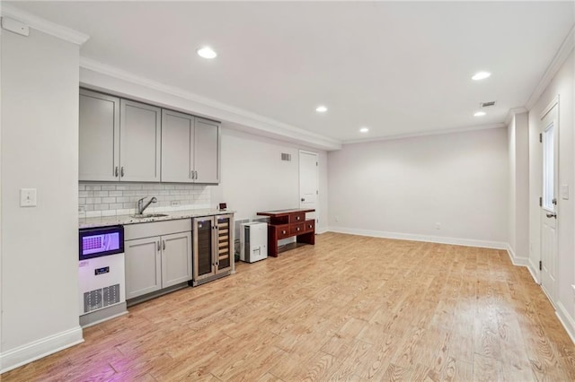 2585 Drew Valley Rd NE, Brookhaven, GA 30319 - indoor wet bar featuring wine cooler, crown molding, recessed lighting, decorative backsplash, and light wood finished floors