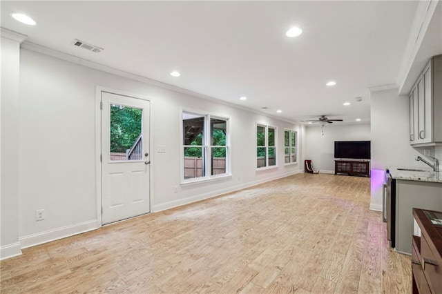 2585 Drew Valley Rd NE, Brookhaven, GA 30319 - unfurnished living room with crown molding, recessed lighting, a sink, light wood-style floors, and ceiling fan