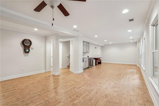 2585 Drew Valley Rd NE, Brookhaven, GA 30319 - unfurnished living room featuring ceiling fan, recessed lighting, ornamental molding, light wood-style floors, and stairs