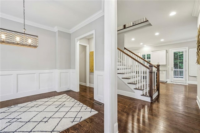 2585 Drew Valley Rd NE, Brookhaven, GA 30319 - foyer featuring ornamental molding, dark wood finished floors, stairway, wainscoting, and recessed lighting
