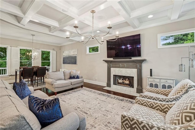 2585 Drew Valley Rd NE, Brookhaven, GA 30319 - living room with a chandelier, baseboards, healthy amount of natural light, coffered ceiling, and wood finished floors