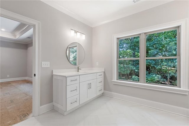 bathroom with vanity and ornamental molding