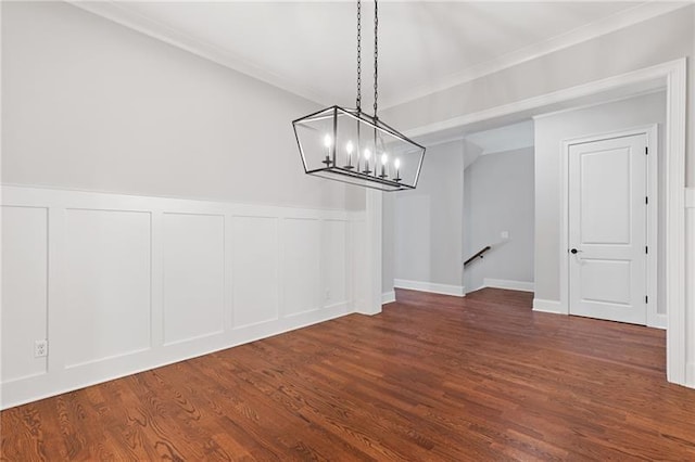 unfurnished dining area with dark wood-type flooring and an inviting chandelier