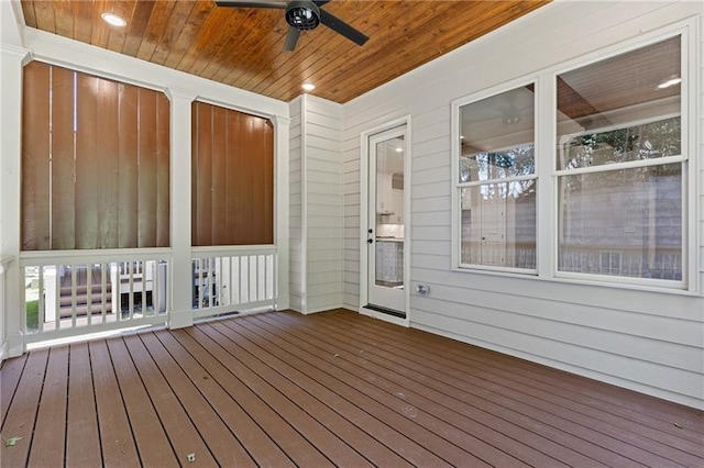 wooden deck featuring ceiling fan