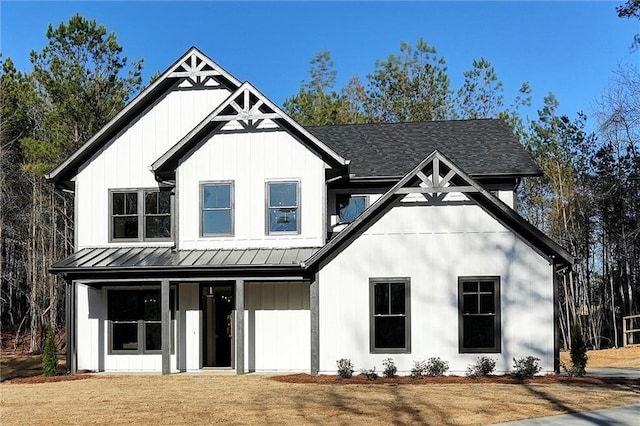 modern farmhouse featuring a standing seam roof, metal roof, and board and batten siding