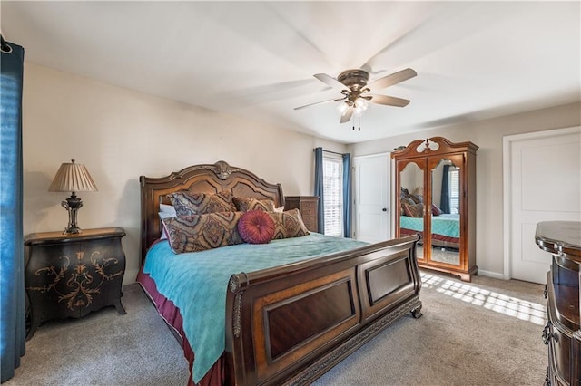 bedroom with access to exterior, light colored carpet, baseboards, and ceiling fan