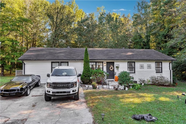 ranch-style house with a front lawn