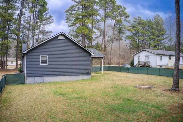 exterior space with a fenced backyard