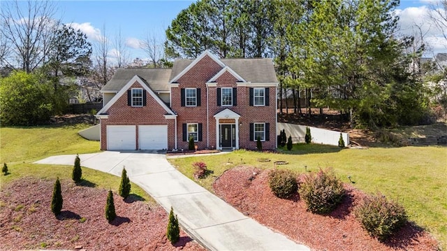 colonial-style house with brick siding, an attached garage, concrete driveway, and a front lawn