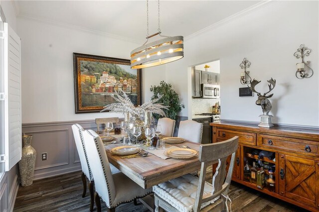 dining room featuring dark wood-type flooring and crown molding