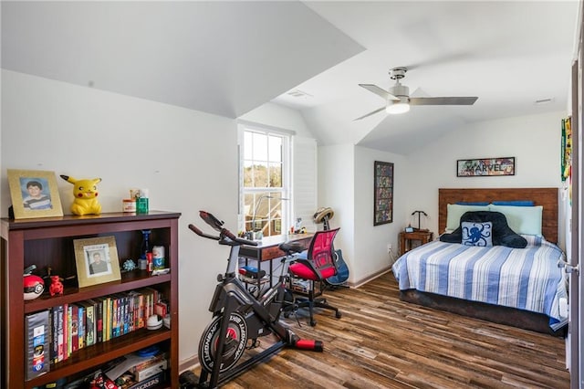 bedroom featuring visible vents, ceiling fan, lofted ceiling, and wood finished floors