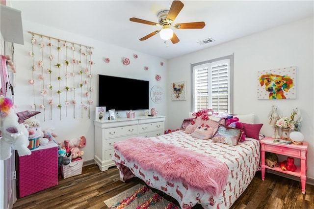bedroom featuring wood finished floors, visible vents, and ceiling fan